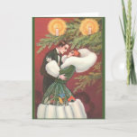 Cartão retro do Natal de Arto Deco<br><div class="desc">Vintage/cartão retro do Natal.  Casal bonito em um abraço loving na frente de uma árvore de Natal!</div>