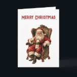 Cartão Retro Papai Noel Sentado em Cadeira de Natal<br><div class="desc">Cartão de Natal com uma imagem de estilo vintage com o Pai Natal clássico sentado numa cadeira de braço antiquada. Adorável design de Natal tradicional.</div>