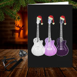 Cartão Rosa de guitarra elétrica de Natal<br><div class="desc">Guitarras elétricas de Natal vestindo cartão de cartões de natal roxos de chapéus santa. Um cartão de natal de pop-arte psicodélica excelente para guitarristas,  músicos e amantes da música,  especialmente raparigas adolescentes. Desenhos de arte psicodélica de três guitarras em arte original eetérea translúcida da artista Catherine Sweetman</div>