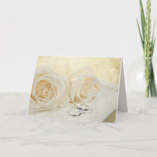 Cartão rosas e anéis de casamento na Bíblia