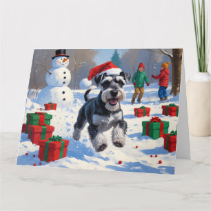 Cartão Schnauzer Correndo na Neve com Chapéu de Natal