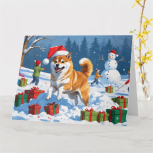 Cartão Shiba Inu Correndo na Neve com Chapéu de Natal