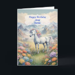 Cartão Sister Birthday Unicorn<br><div class="desc">Mande desejos para um aniversário mágico. Deseje à sua irmã um feliz aniversário de unicórnio. Uma imagem sonhadora de um unicórnio branco com um arco-íris principal em um campo de flores. ao fundo estão montanhas majestosas. A carta perfeita para dar àqueles que amam unicórnios mágicos e místicos.</div>