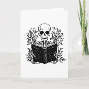Cartão Skeleton lendo livro romântico