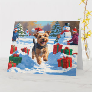 Cartão Skye Terrier Correndo na Neve com Chapéu de Natal