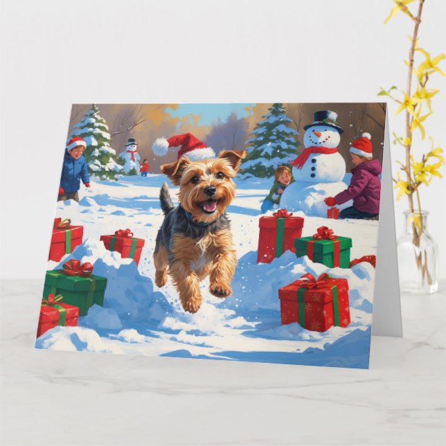 Cartão Skye Terrier Correndo na Neve com Chapéu de Natal (Flor Amarela)
