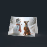 Cartão Snowman De Natal Com Cachorro Irlandês<br><div class="desc">Um boneco de neve e um cão Setter irlandês ambos vestindo lenços compartilham um momento de companhia em um cenário de floresta nevada</div>
