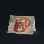 Cartão Taça Snowman de Natal Mais Feliz<br><div class="desc">Arte original com minha fotografia original de uma xícara de estilo vintage com um boneco de neve nele; estilizada com um efeito de fantasia de aquarela para uma aparência ilustrada e caprichosa de neve. A frente do cartão diz "Tenham uma taça de alegria!" e a dentro do cartão diz: "Espero...</div>