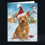 Cartão Terrier Winter Wonderland Natal australiano<br><div class="desc">seu design festivo captura o espírito alegre da época de férias, apresentando um adorável filhote vestindo um chapéu de Papai Noel. O gato está aninhado numa terra maravilhosa de inverno, completo com um boneco de neve, uma árvore de Natal decorada, e presentes lindamente envoltos. Os flocos de neve caem suavemente,...</div>