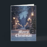 Cartão Village Winter Scense Feliz Natal<br><div class="desc">A cena de inverno da vila medieval é um cartão de boas-vindas de Natal. Uma grande passagem iluminada por luzes de rua cria um brilho mágico na neve caindo. À distância, é visível um fogo catedral. A mensagem dentro lê Warm Wish to You & Yours (Desejo Caloroso a você e...</div>