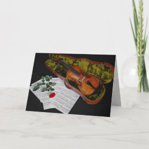 Cartão Violino e rosa vermelha sobre fundo preto