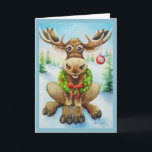Cartão Whimical Winter Christmas Moose Watercolor Art<br><div class="desc">Cartão de Saudação de Arte por Aquarela de Natal do artista Jean Weiner "Moose de Natal" apresenta um alce de inverno caprichoso pronto para celebrar o Natal. Este alce está vestindo uma nova coroa de verduras sagradas ao redor do pescoço. A coroa tem bagas vermelhas e um arco vermelho brilhante....</div>