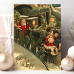 Cartões de natal Train Vintage<br><div class="desc">Belos natais vintages Treinam cartão-postal. "Cartões de natal" escritos no canto inferior esquerdo. Este design apresenta um condutor de trem do Papai Noel com duas crianças pequenas pegando carona na frente do trem.</div>