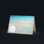 Cartões de Natal tropicais da praia do dólar de<br><div class="desc">Cartões de Natal tropicais do dólar da praia e de areia. A água azul bonito de turquesa e de aqua é o fundo para o cumprimento robusto, aberto do estilo de pia batismal. Personalize o texto na parte dianteira e no interior. Um único dólar de areia branco, em um Sandy...</div>
