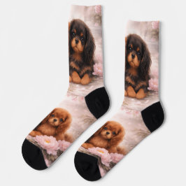 Cavalier spaniel cachorros em flor na primavera