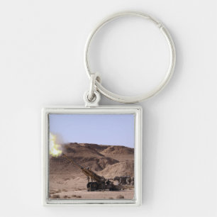 Chaveiro A chama e o fumo emergem do focinho