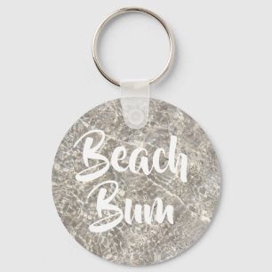 Chaveiro Água do vagabundo da praia na areia da praia