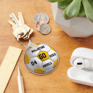 Chaveiro amarelo e branco da bola de futebol