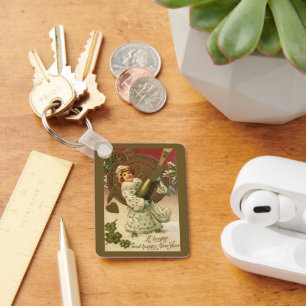 Chaveiro Anjo do Champanhe da Véspera de Ano Novo Vitoriana