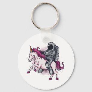 Chaveiro Astronauta montando uma camiseta rosa do Unicórnio