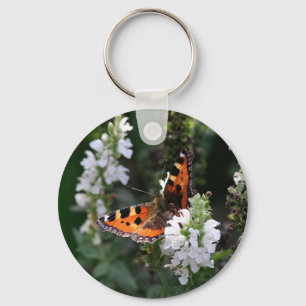 Chaveiro Borboleta Laranja e Preta em Flores Brancas