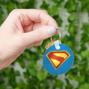 Chaveiro Brilhante da blindagem S do Ouro Superman