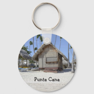 Chaveiro cabana de grama numa praia tropical