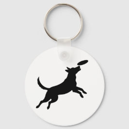 Chaveiro cachorro saltando para pegar um frisbee