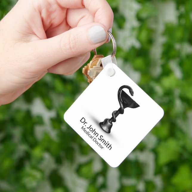 Chaveiro Caduco Branco da Hygieia Cobra Médica Preta (Mão)