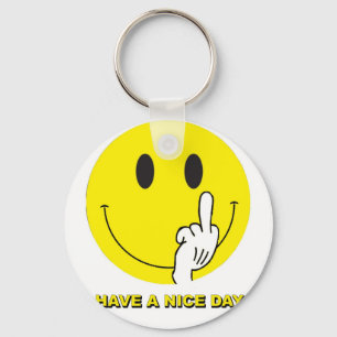 Chaveiro cara que dá o dedo