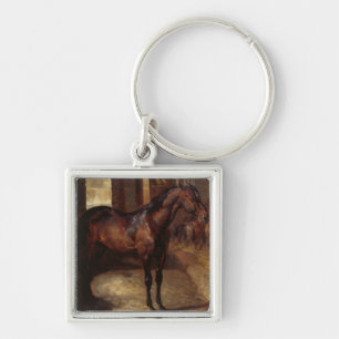 Chaveiro Cavalo de baía escuro no estábulo