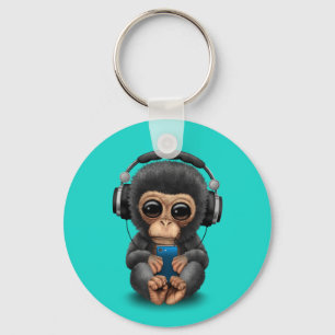 Chaveiro Chimpanzé do bebê com fones de ouvido e telemóv