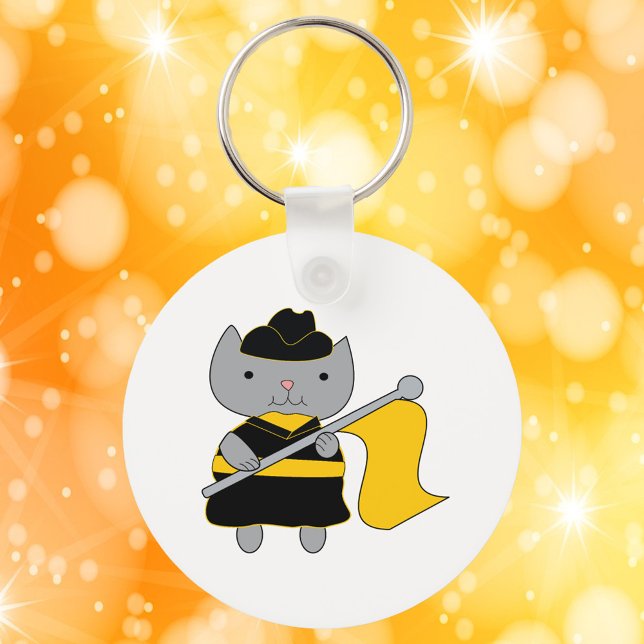 Chaveiro Color Guard Kawaii Cat Black Yellow (A keychain featuring a cute gray cat in a black & yellow color guard uniform.)