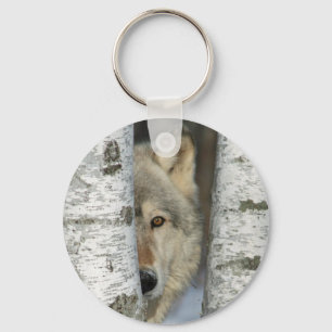 Chaveiro com a foto do lobo cinzento em árvores d