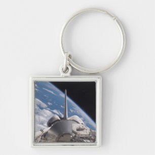 Chaveiro Descoberta do vaivém espacial backdropped pela