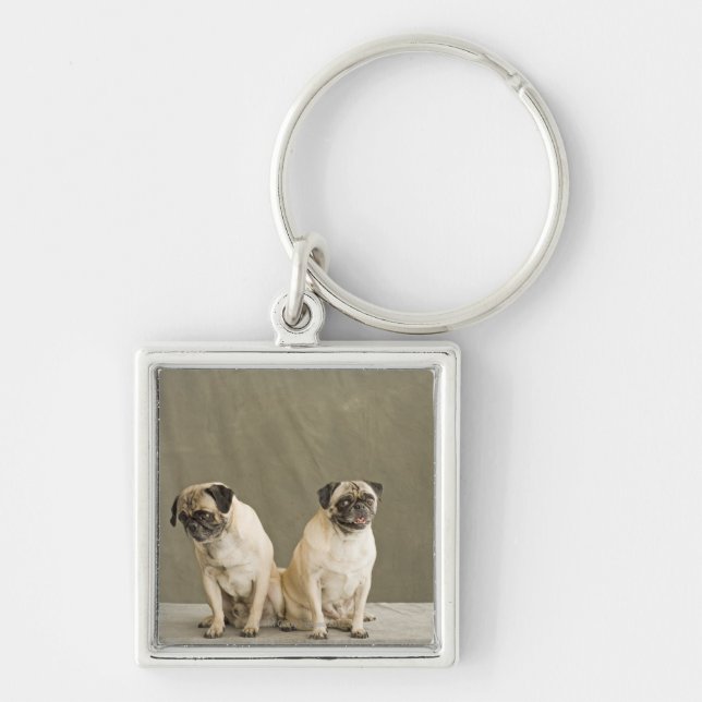 Chaveiro Dois cães que levantam em uma mesa (Frente)