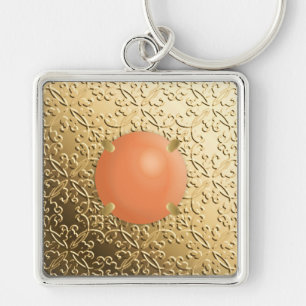 Chaveiro Dourado Damask com uma pedra preciosa de coral fal