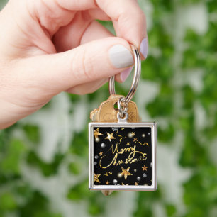 Chaveiro Dourado Natal das Estrelas do Metálico Negro