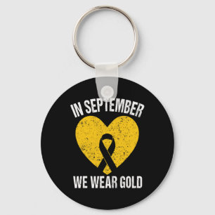 Chaveiro Em setembro Vestimos o Cancer Dourado da Infância