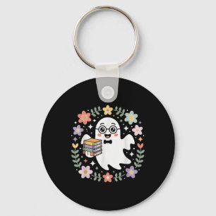 Chaveiro Fantasma segurando livros cercado por flores e