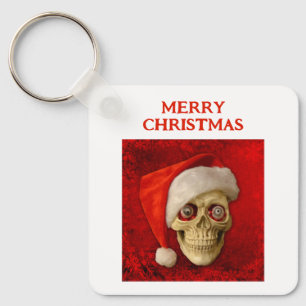 Chaveiro Feliz Natal. Caveira usando chapéu de Papai Noel