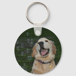 Chaveiro Filhote de cachorro do golden retriever nas bolhas