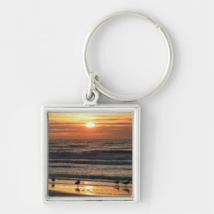 Chaveiro Gaivotas pelo oceano ao pôr do sol