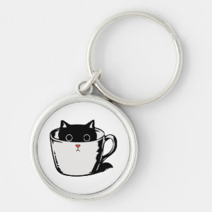 Chaveiro Gato preto com nariz vermelho escondido em um copo