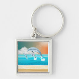 Chaveiro golfinhos respirando no oceano