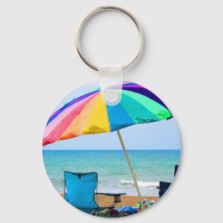 Chaveiro Guarda-chuva e cadeiras coloridas de praia na Flór