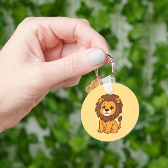 Chaveiro Leão de desenho animado fofo em amarelo (Mão)