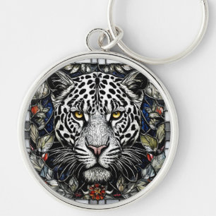 Chaveiro Leopardo preto e branco cercado por flores