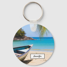 Chaveiro Linda praia tropical com um barco a remo