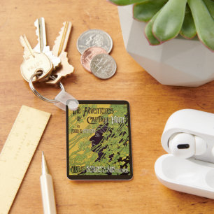 Chaveiro Livro Vintage Art Nouveau, Capitão Horn Adventures